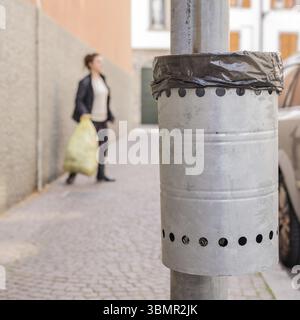 Trash metal gray for the collection of waste of the road Stock Photo
