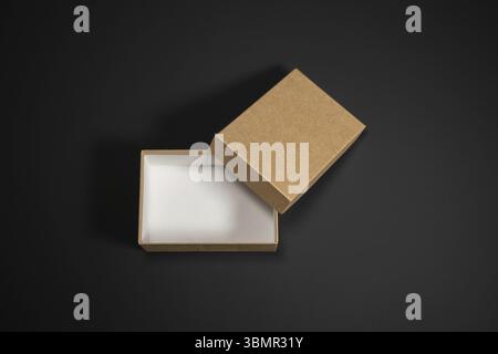 Wrapped vintage gift boxes with red ribbon bow, isolated on black Stock Photo