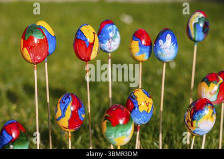 Poppy colorful Easter eggs with different colors uniquely hand-painted Stock Photo