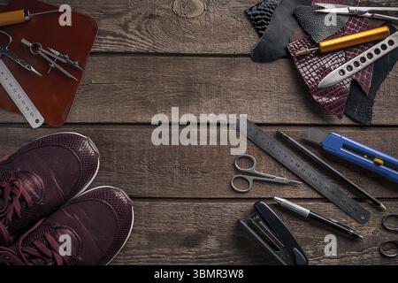 Leather crafting. Tools flat lay still life. Top view. Copy space Stock Photo