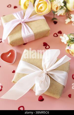 Valentine's Day, Women's Day, birthday, mothers day greeting card background with handmade present box and spring flower on pink background Stock Photo
