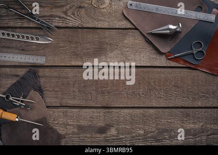 Leather products. Work place craftsman in a workshop. Place for your text or logo. Ideal for blog. Top view Stock Photo