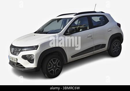 Modern white Renault Kwid exhibiting its sleek design and fuel efficiency, parked against a clean white backdrop Stock Photo