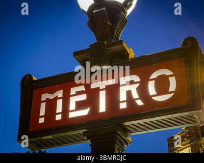 Paris, France. May 15, 2025, Illuminated Paris Metro Sign at Twilight near Pont Neuf Stock Photo