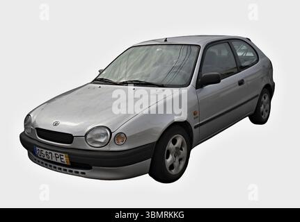Three-door hatchback Toyota Corolla E11 with a 1.3 liter petrol engine, produced from 1995 to 2002, isolated on white Stock Photo