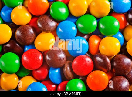 Multi-colored sweet candies (confectionery) of different colors. Colorful abstract background. Many Colorful Chocolate Candies for background. Stock Photo