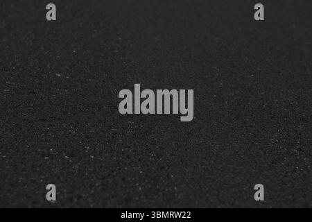 Freshly laid black asphalt on the street.. Background, copy space. Stock Photo