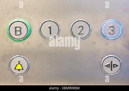 Closeup of metal buttons in an elevator background Stock Photo