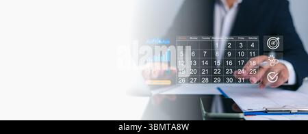 Person interacting with a digital calendar overlay, planning business tasks with icons for growth, gears, targets, and checkmarks, Efficient schedulin Stock Photo