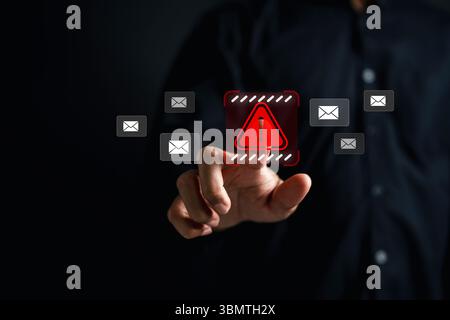 Email spam alert with cybersecurity threat warning symbol. Concept of phishing, email scam, data breach, and online security risk. Protect inbox from Stock Photo