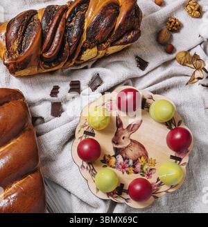 food still-life, Easter eggs with buns on top view Stock Photo