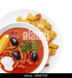 food still-life, Hodgepodge soup in ceramic pot on white Stock Photo