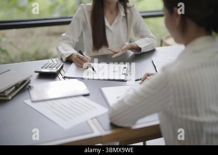 Confident business working woman working together. Creative female executives meeting in startup office Stock Photo