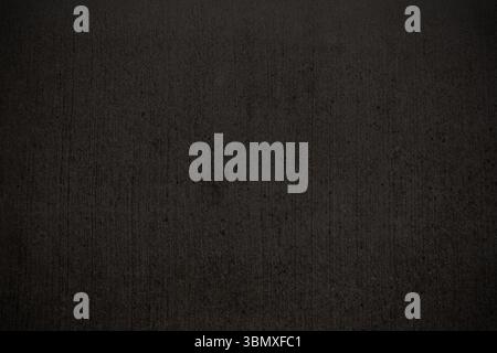 Flat design dark grey textured surface is showing wall look, with subtle streaks and speckles Stock Photo