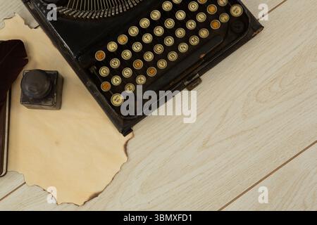 Typewriter and stamp on table Stock Photo