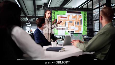 Young Designer Presenting 3D House Floor Plan For Real Estate. Stock Photo
