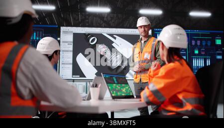 Multiracial Engineer Giving Innovative 3D Aerospace Design Presentation On Monitor Stock Photo