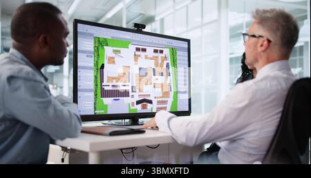 Real Estate Agent Using CAD Software To Remodel Property Interior. Stock Photo