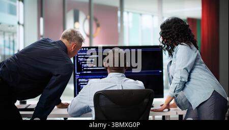 Diverse Programmer Team Efficiently Coding Agile Projects In Development Environment. Stock Photo