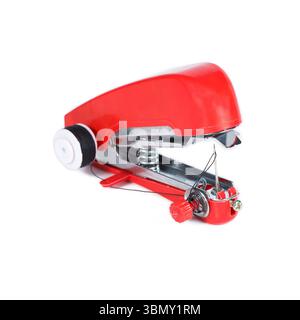 It is Red handheld sewing machine isolated on white. Stock Photo