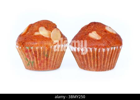 It is Two Banana cupcakes with almond isolated on white. Stock Photo