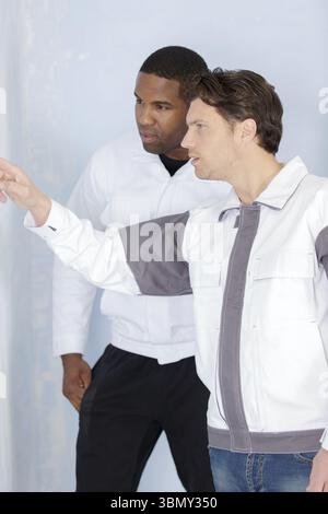 young apprentice painter in professional training Stock Photo