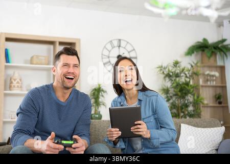 happy couple using modern drone Stock Photo