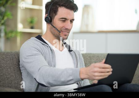 happy businessman working on laptop at home office Stock Photo
