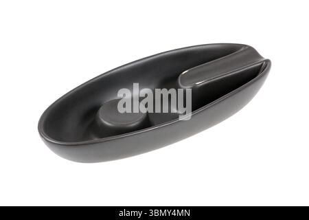 It is Black terracotta cigar ashtray isolated on white. Stock Photo
