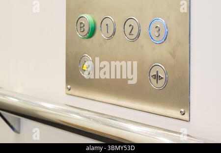 Closeup of metal buttons in an elevator background Stock Photo