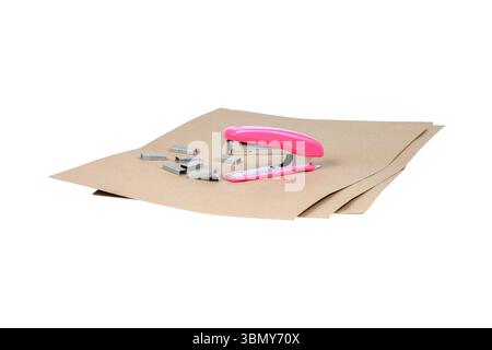 Stapler and staples on pieces of paper Stock Photo