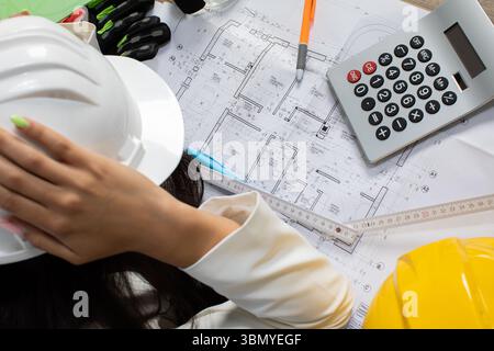Understanding and Managing Stress in Construction Planning with the Use of Safety Gear Stock Photo