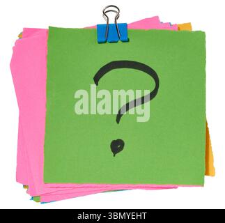 Stack of multicolored sticky notes with a black question mark drawn on the top green sticky note, secured with a blue paper clip. Isolated background Stock Photo