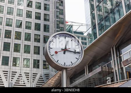 Contemporary Urban Clock in Business District with Modern Glass Office Towers Stock Photo
