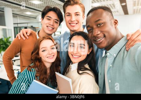 Happy international students taking selfie in university Stock Photo