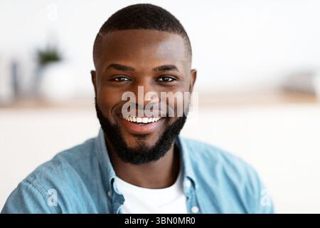 Closeup Portrait Of Young Cheerful Handsome African American Man Smiling At Camera Stock Photo
