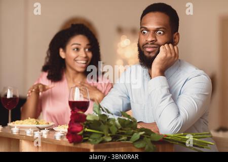 Black Couple On Unsuccessful Blind Date In Restaurant Stock Photo