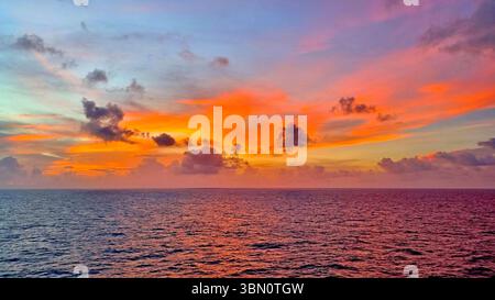 A multicolored sunset sky over the Caribbean Sea, perfect for wallpaper Stock Photo