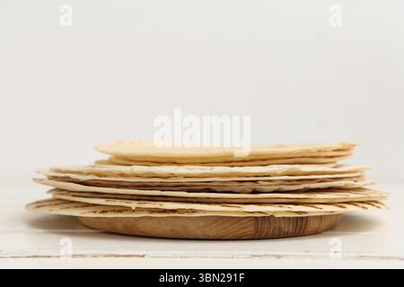Stack of tasty lavash on white background, closeup Stock Photo
