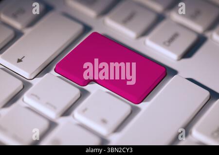 Pink enter key on keyboard Stock Photo