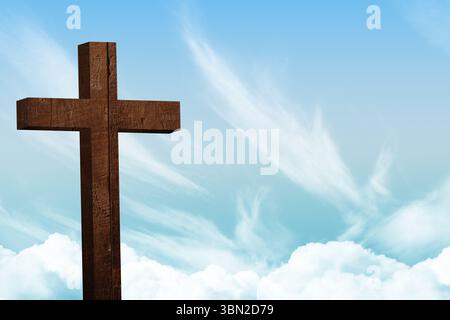 Flat design wooden cross rising against bright sky with cirrus and cumulus clouds, copy space Stock Photo
