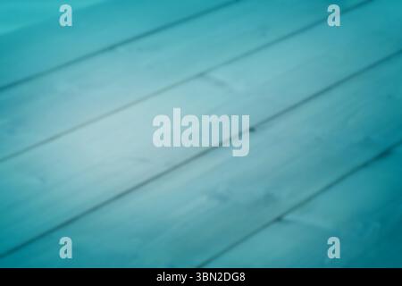 Blurred blue-tinted horizontal wooden planks are being shown in flat design with teal gradient Stock Photo