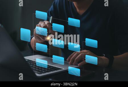 Workflow diagram overlay on laptop screen. Business process mapping and data structure visualization. Man working with digital flowchart interface. Sm Stock Photo