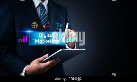 Close-up of digital marketing professional analyzing marketing data and online advertising on tablet. Perfect for growth strategy, digital advertising Stock Photo