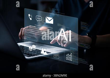 Business hand using artificial intelligence system, displaying email, finance, chart and communication icons on hologram interface.Chatbot conversatio Stock Photo