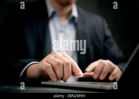 Close-up of hands on keyboard, concept of business management, report preparation, and workplace productivity in a professional setting. Stock Photo