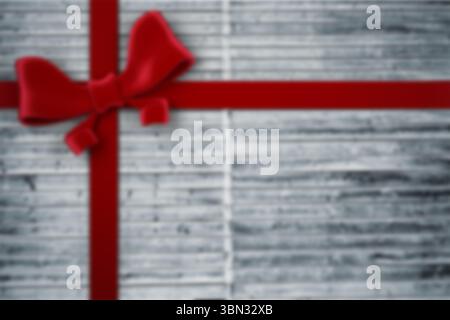 Red satin ribbon and bow are crossing metallic silver ridged gift wrap in flat design Stock Photo
