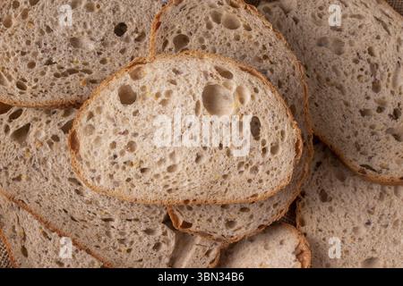 Sliced â€‹â€‹whole grain bread with corn, close-up, top view Stock Photo