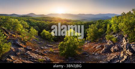 Amazing mountain landscape with colorful vivid sunset on the cloudy sky, natural outdoor travel background. Beauty world Stock Photo