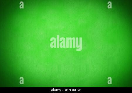 Green textured backdrop is creating soft vignette effect in flat design style, copy space Stock Photo